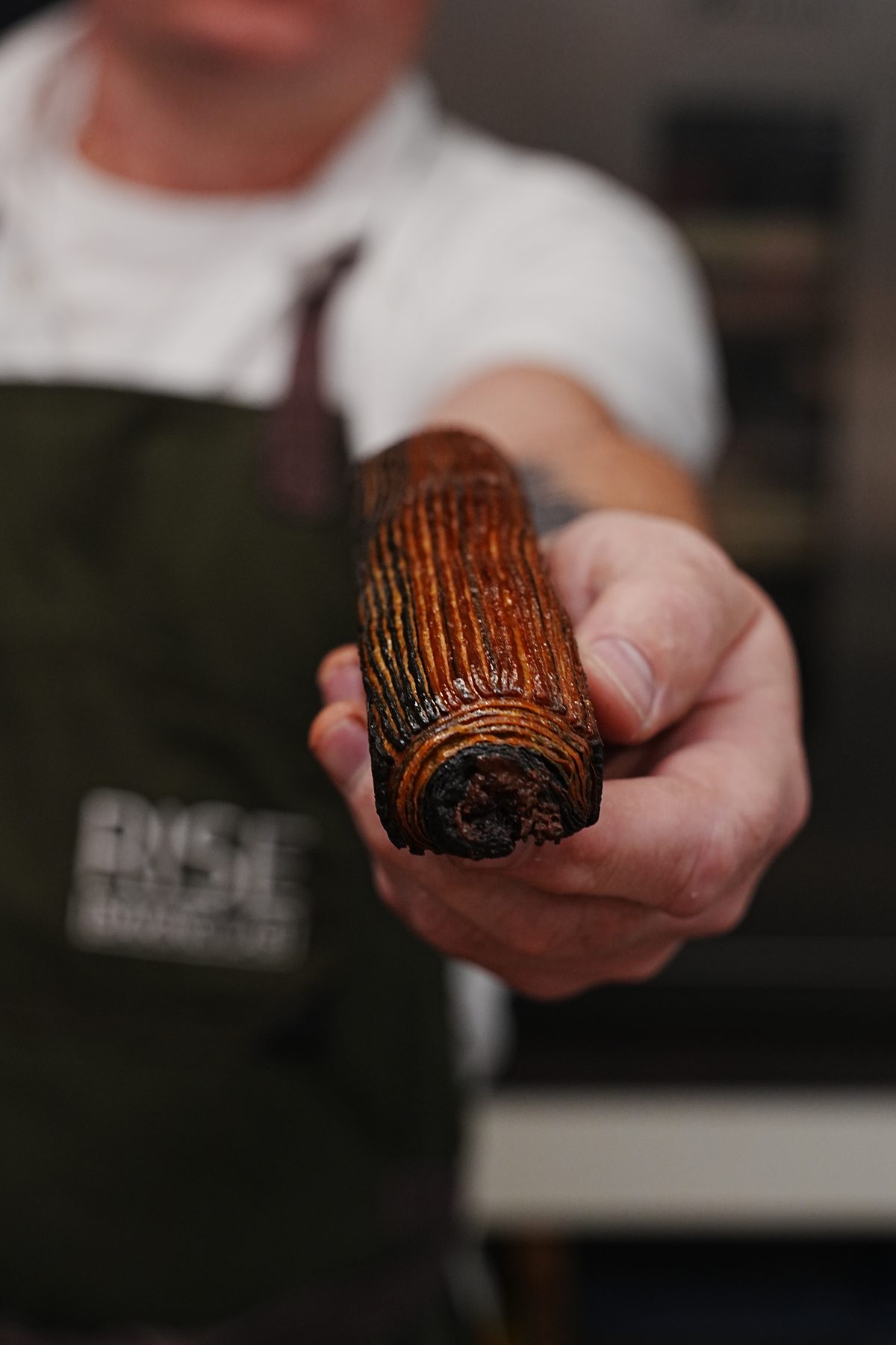 Instructor holding a finished pastry